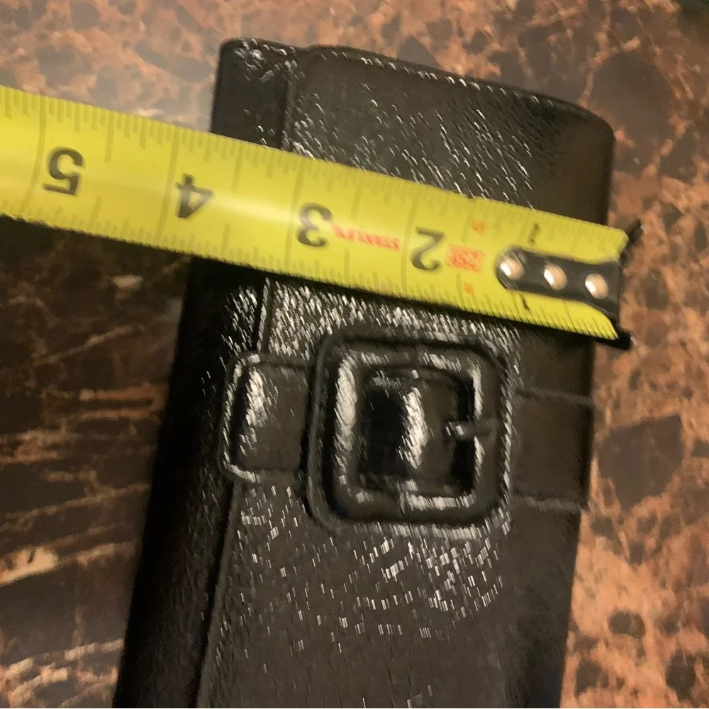 Black RGA trifold wallet with faux buckle detail